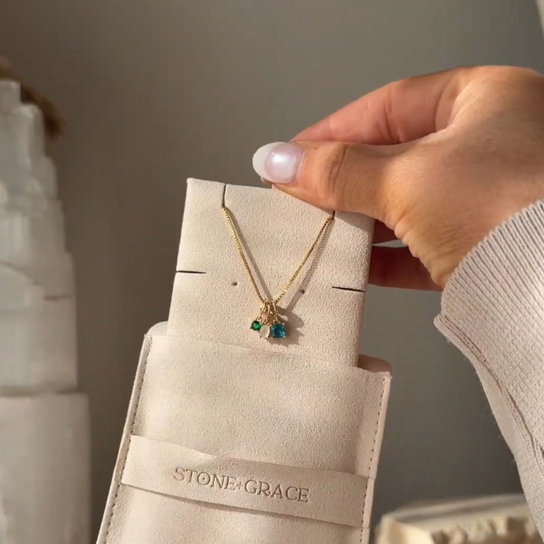 Birthstone necklace in its pouch