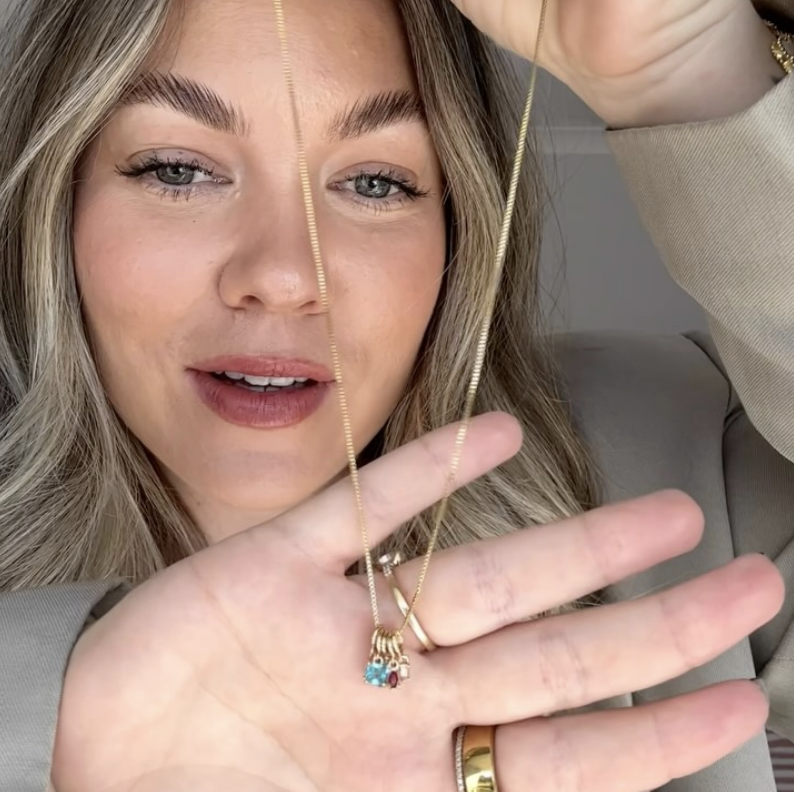 Sarah wearing her birthstone necklace